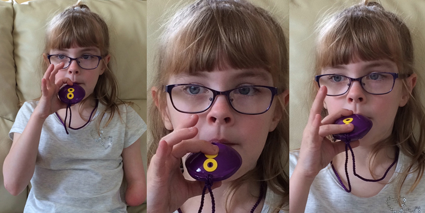 One-handed Ocarina - child playing the Ocarina with just one hand